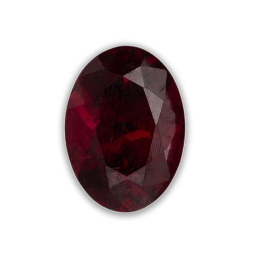 Faceted red garnet on a white background