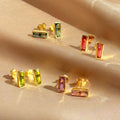 Set of colorful baguette-cut gemstone stud earrings including blue labradorite, garnet, amethyst, citrine, and peridot. Handmade jewelry by Danique Jewelry in 18K gold vermeil or sterling silver. Dainty minimalist earrings perfect for layering or mix-and-match birthstone sets. Personalized jewelry gift for her, bridesmaid, or birthday, with bright natural stones in modern rectangular bar design.