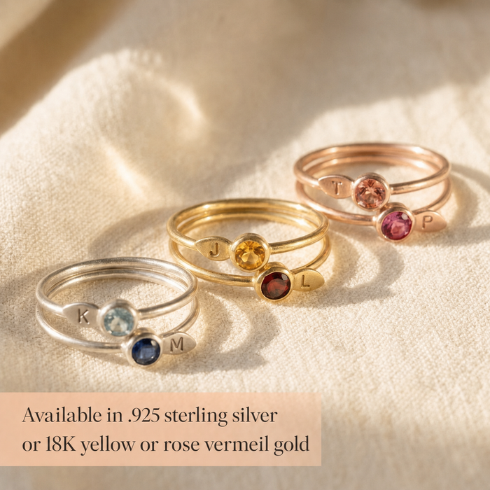 Gold and silver birthstone stacking rings with stamped leaf initials and 3mm gemstones, available in sterling silver or gold.