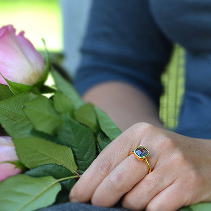 Model wearing Black Rutilated Quartz gold plated cushion bezel square stacking ring
