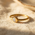 Cabochon opalite ring in gold bezel setting minimalist October birthstone ring