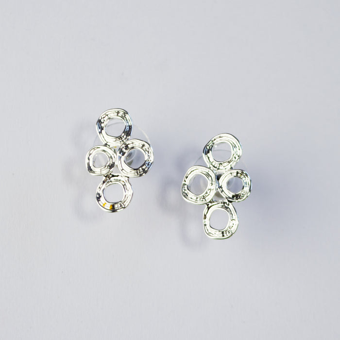 Abstract boho style silver double circle statement earrings, jewelry for summer, summer vacation fashion, statement geometric pendant, jewelry to wear to anniversary dinner, date night jewelry, artsy standout jewelry, silver stud earrings, gold stud earrings, boho earring collection