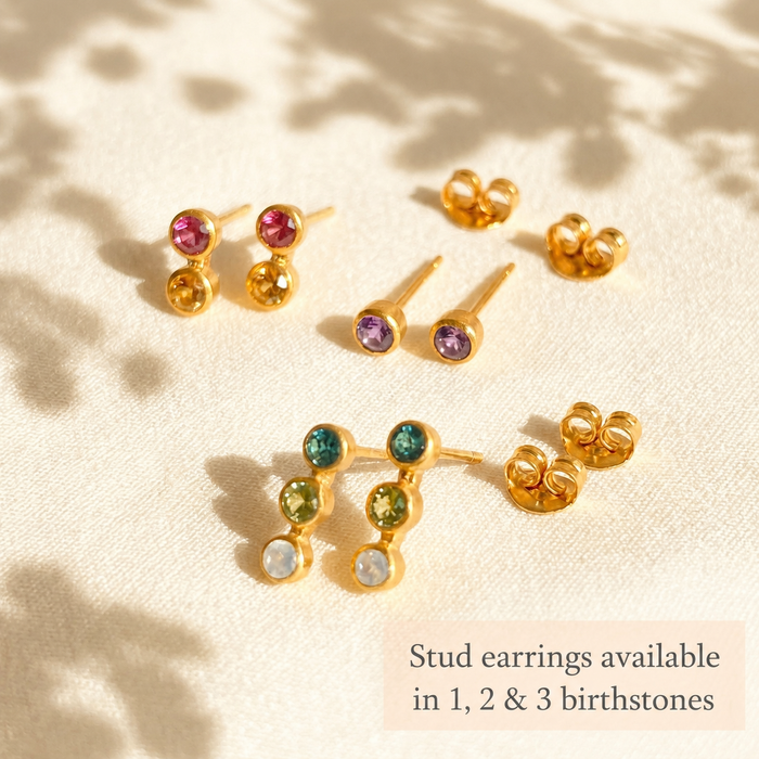 Custom birthstone stud earrings arranged in one, two, and three stone options with text showing available birthstone styles for personalized gemstone jewelry.