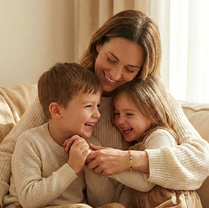 Mother wearing a personalized birthstone bracelet while spending time with her children, showcasing a meaningful family jewelry design with multiple birthstones. Custom bracelet representing kids or grandkids, handcrafted with tiny gemstones on a delicate chain. Emotional gift for mom, new mom, or grandma, perfect for Mother’s Day or family milestone celebrations.