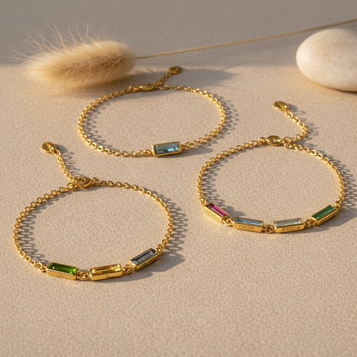 Personalized birthstone bracelets in gold, silver and rose gold finishes displayed together, custom engraved gemstone bar bracelets available with one or multiple birthstones for mom or grandma, elegant family jewelry gift idea for Mother’s Day or Christmas.