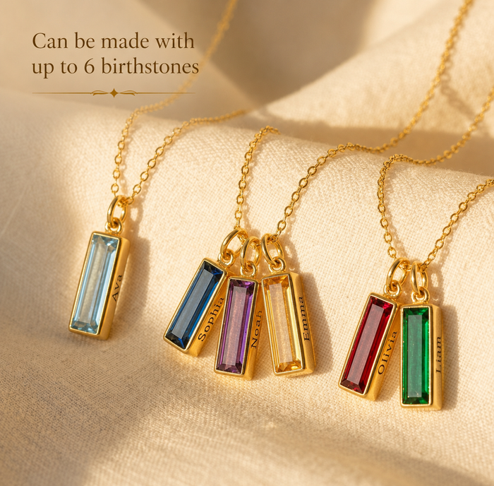 Custom family birthstone necklace with one, three, and three gemstone bars shown on gold chains.