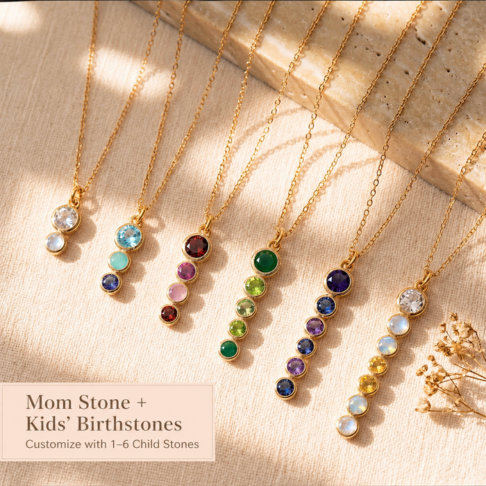 Multiple personalized birthstone necklaces arranged in soft light, showing different mom stone and kids’ birthstone combinations for custom family jewelry.