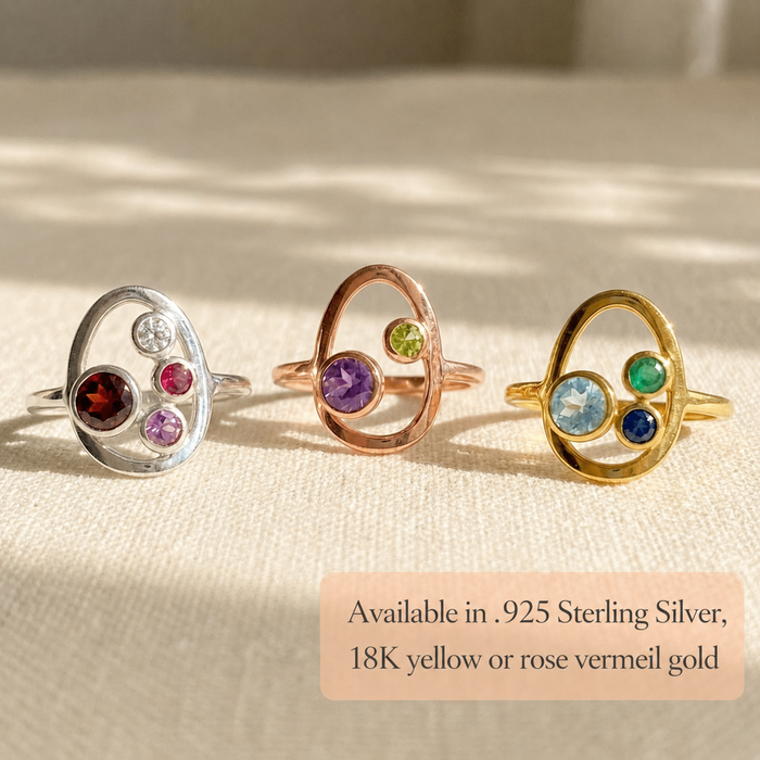 Custom birthstone ring shown in gold, sterling silver, and rose gold with one mom stone and kids birthstones.