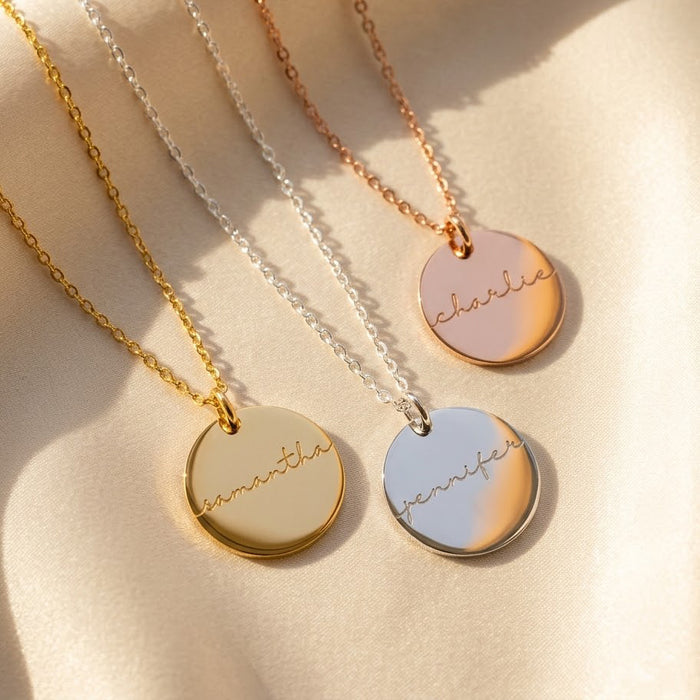 Custom engraved name disc pendant necklaces in gold, silver, and rose gold, personalized minimalist jewelry gift for her.