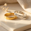 Custom handwriting engraved rings in gold and sterling silver with names and meaningful phrases on 4mm bands.