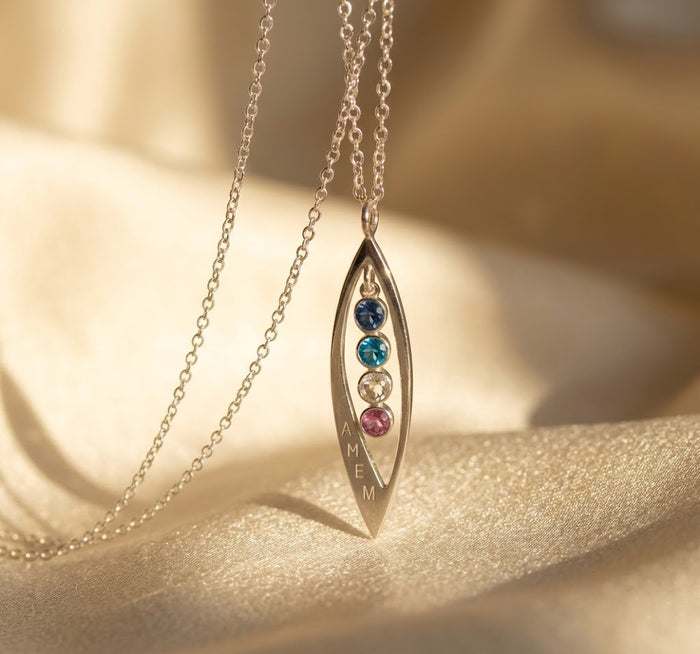 Dainty marquise necklace worn on neckline, minimalist birthstone pendant for layering and everyday styling in sterling silver