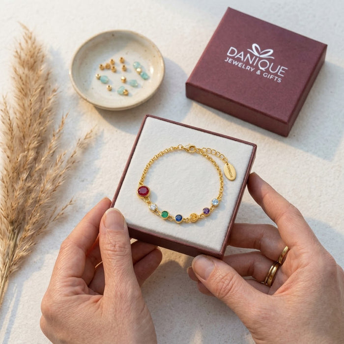 Personalized birthstone bracelet worn daily with engraved initial charms, meaningful Mother’s Day gift representing kids and family in Danique Jewelry branded box