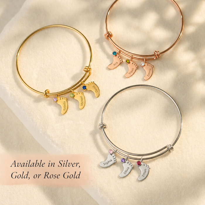 Gold, silver, and rose gold footprint charm bangle bracelets with custom engraved names and tiny birthstones.