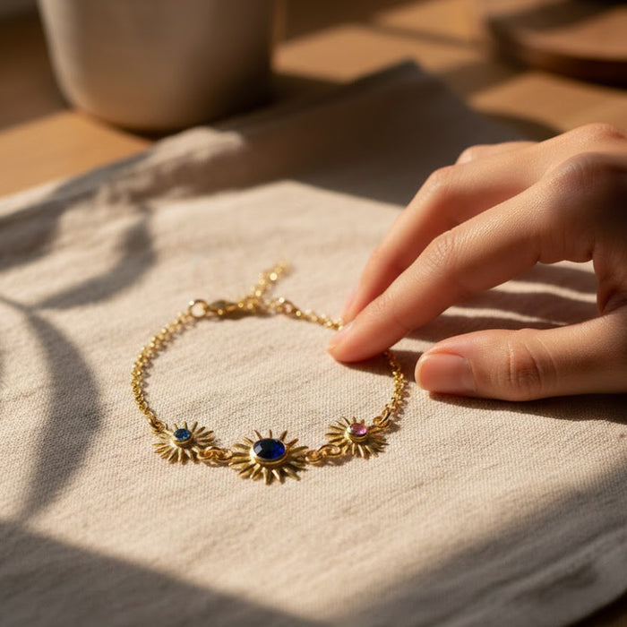 Sunburst birthstone bracelet shown on wrist to demonstrate size and scale, featuring a 5mm gemstone for mom and 3mm gemstones for children. Personalized family bracelet designed for comfortable everyday wear.