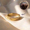 Custom dog nose print ring in gold finish engraved from your pet’s actual nose texture using a photo, shown with a close up nose reference and arrow pointing to the detailed “boop print” pattern, a meaningful pet memorial ring and keepsake jewelry for dog moms, pet lovers, and sympathy gifting, with optional inside engraving for name date or short message, polished comfort band for everyday wear.