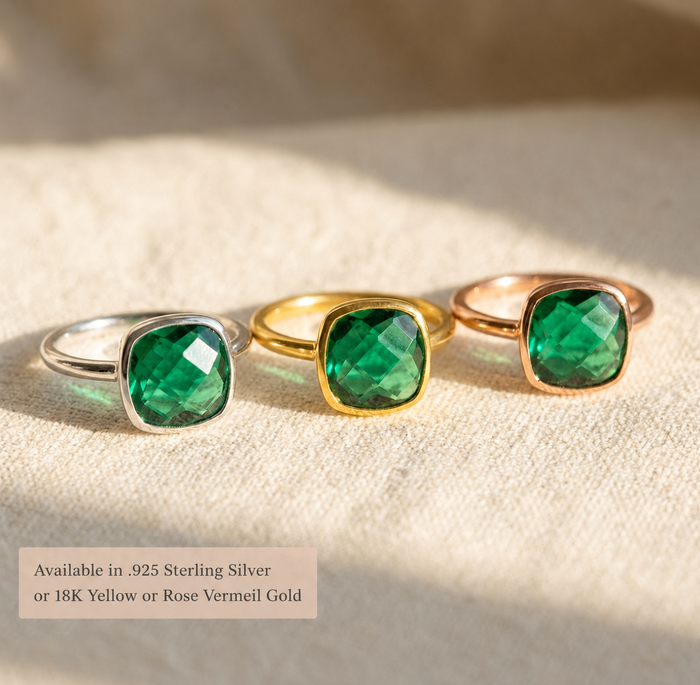 Three emerald quartz cushion rings shown in sterling silver, yellow gold, and rose gold finishes with text overlay for metal options.