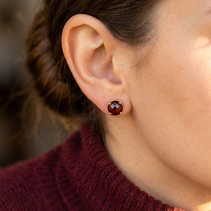Faceted birthstone stud earrings on ear gold prong set gemstone studs minimal everyday jewelry look