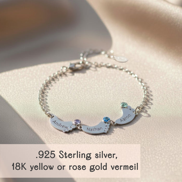 Sterling silver personalized footprint bracelet with up to six engraved footprint charms and matching birthstones, custom family bracelet perfect for moms of several children or a thoughtful grandma gift.