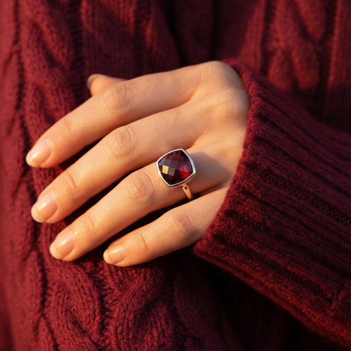 Cushion cut garnet ring worn on hand – minimalist red gemstone stacking ring for women