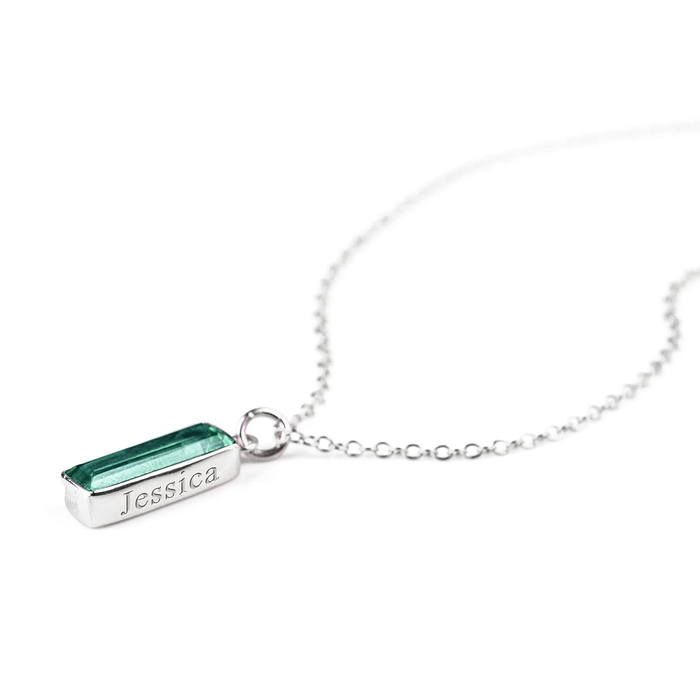 Single sterling silver cable chain with green tourmaline vertical adira birthstone bar necklace with name engraved in classic font.