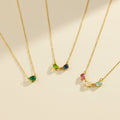 Horizontal oval birthstone necklace featuring custom multi-stone family jewelry design with dainty oval bezel gemstones, shown with emerald quartz, blue topaz, peridot, amethyst, and moonstone stones. Personalized mom necklace ideal for child name engraved gifts, Mother’s Day, birthdays, or Christmas gifting. Handmade in gold, rose gold, or sterling silver and perfect as a sentimental necklace for mom, grandma, or a new mother celebrating her children.