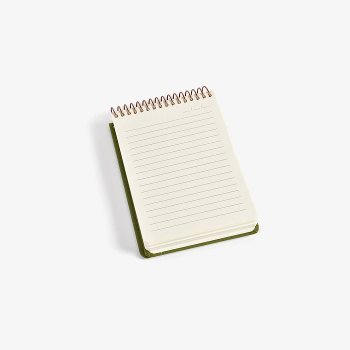 Small spiral-bound notebook with lined pages on a white background
