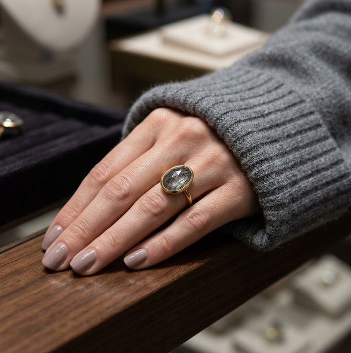Black rutilated quartz statement ring worn with sterling silver finish
