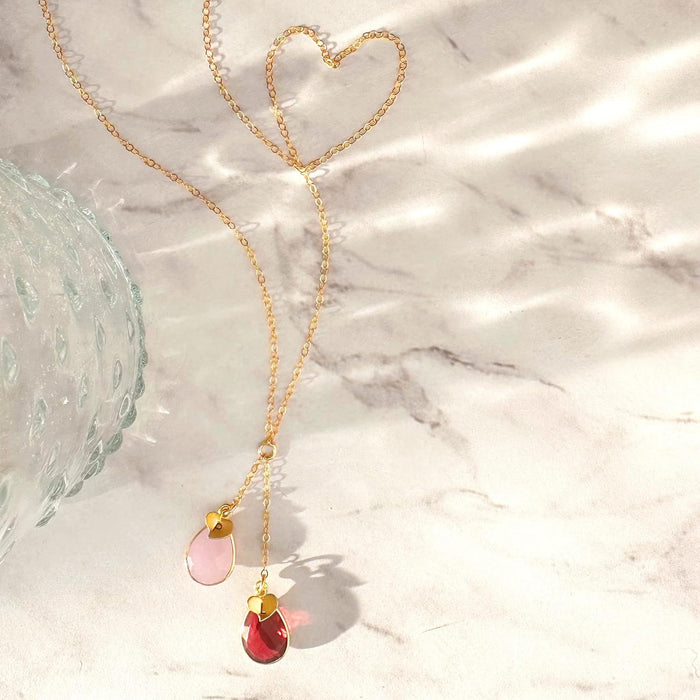 Gold lariat necklace with pink chalcedony and garnet birthstones. October birthstone, january birthstone, october birthstone necklace, jewelry gift, necklace gift for her, anniversary gift, christmas gift, valentine's day gift, wedding jewelry, bridesmaid's jewelry, gift for mom, gift for wife, gift for girlfriend, gift for grandma, mother's day gift