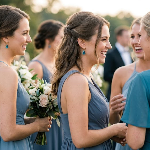 Bride or bridesmaid wearing London blue topaz teardrop earrings, elegant blue gemstone wedding earrings