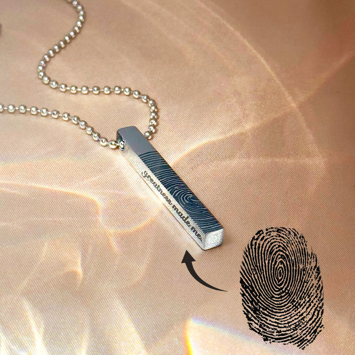 Custom fingerprint engraved 3D bar necklace for men shown in bright light, showcasing personalized vertical bar pendant with fingerprint etching, names or meaningful coordinates. Masculine stainless steel necklace gift for boyfriend, husband or memorial keepsake, modern men’s jewelry with four-sided engraving options.