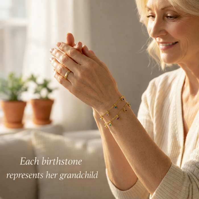 Grandma admiring her birthstone bracelet, each gemstone representing her grandchild, sentimental family jewelry gift from children or grandchildren