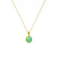 A Mint Green Chrysoprase cabochon necklace in vermeil gold hangs on a Gold Filled Cable Chain against a white background. Shimmering Golden Mint Green Chrysoprase Necklace, Dainty Gold Gemstone Necklace