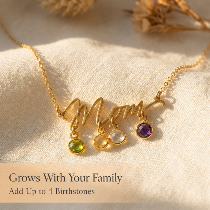 Gold Mom necklace with round birthstone charms and text explaining it grows with your family and can include up to four stones.