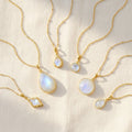 Moonstone necklaces in gold with teardrop, oval, round and geometric pendants, elegant June birthstone jewelry collection for women