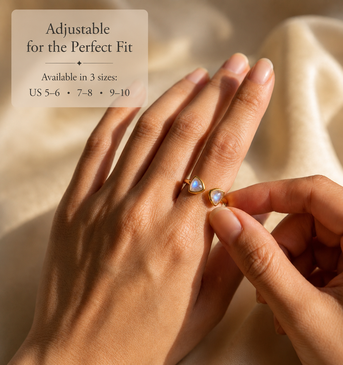 Hands adjusting moonstone triangle ring with size options US 5–6, 7–8, and 9–10.
