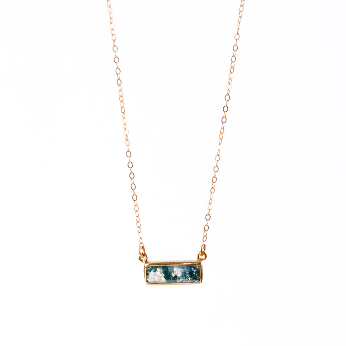 Single rode gold filled cable chain with horizontal moss agate adira bar necklace on white background