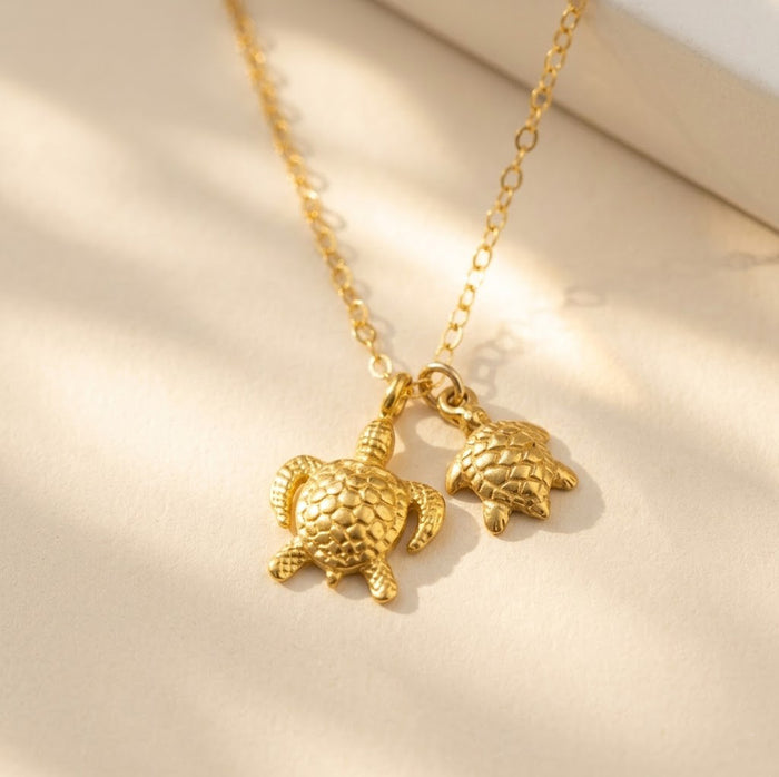 Custom turtle necklace displayed in a Danique Jewelry gift box, ready for Mother’s Day, birthday, or new mom gifting.