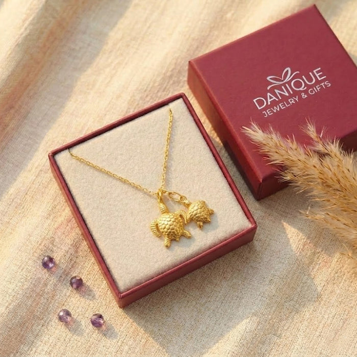 Handmade mama and baby sea turtle necklace with textured turtle charms, a sweet family jewelry gift for mom or grandma in Danique Jewelry branded box