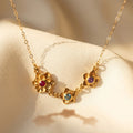 mother birthstone flower necklace with multiple small gemstone charms gold