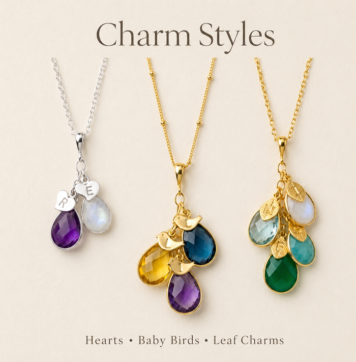 Charm style options for personalized birthstone necklace, showing leaf, bird, and heart initial charms for custom family jewelry.