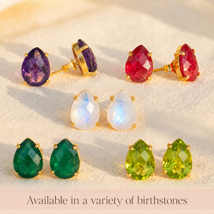 Teardrop gemstone stud earrings in multiple birthstone colors, including rainbow moonstone, amethyst, ruby, emerald, peridot, and blue topaz.