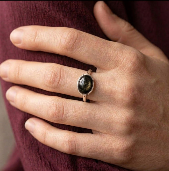 Model wearing black obsidian cabochon ring as a minimalist gemstone ring gift for her
