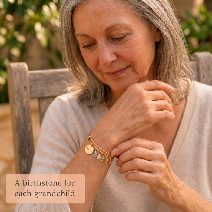 Custom engraved birthstone bangle bracelet in Danique Jewelry gift box, made as a meaningful family keepsake for Mom or Grandma.