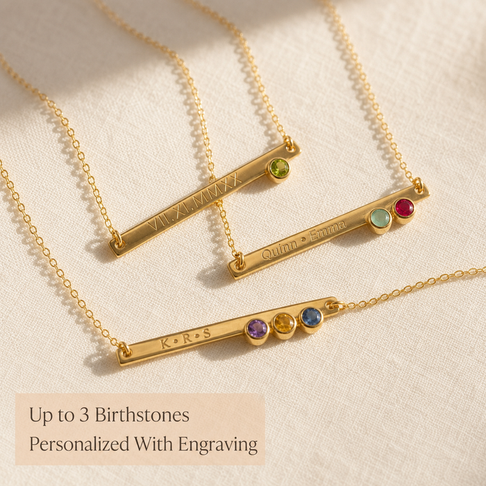 Custom birthstone bar necklaces with up to three birthstones and engraved names on gold chains