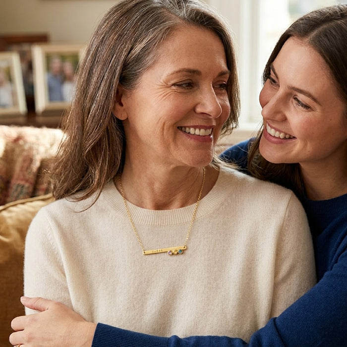 Mother and daughter wearing personalized engraved birthstone bar necklace as family keepsake jewelry