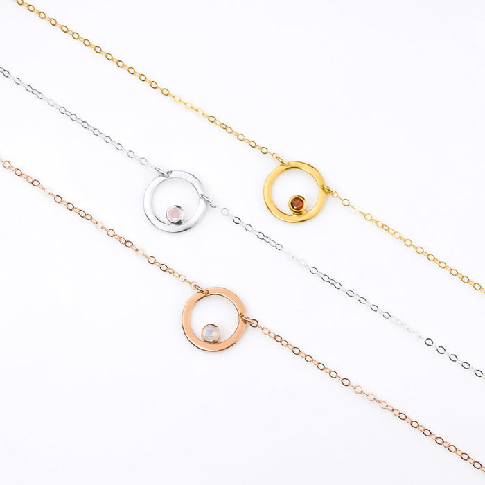 Rose gold filled circle moonstone birthstone necklace, Sterling silver open circle geometric necklace with pink chalcedony birthstone and a gold filled open circle necklace with garnet birthstone.