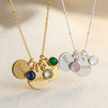 Gold filled cable chain necklace with three engraved disks and kyanite, sky blue quartz and green onyx birthstones. Sterling Silver necklace with satellite chain and two engraved name disks with pink chalcedony and moonstone birthstones.