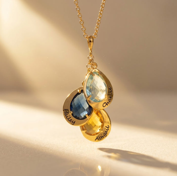 Personalized birthstone necklace for mom with teardrop gemstone charms and engraved names, a meaningful custom family necklace for mothers or grandmothers.