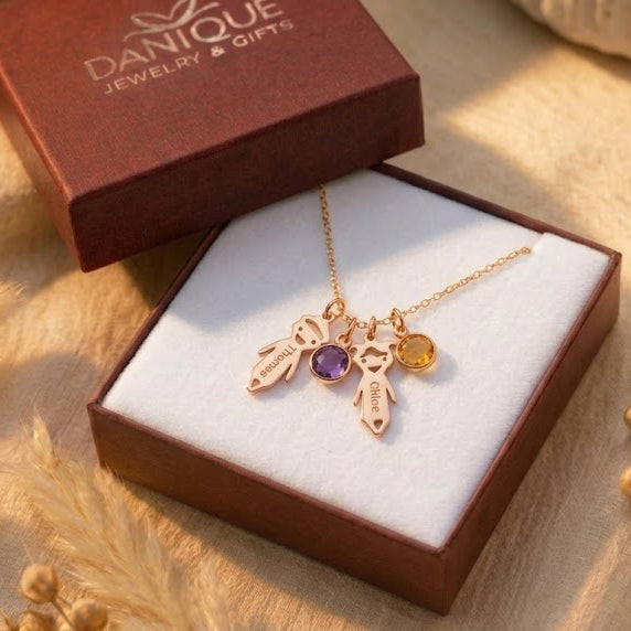 Personalized kids charm necklace displayed in a Danique Jewelry gift box, ready for gifting.