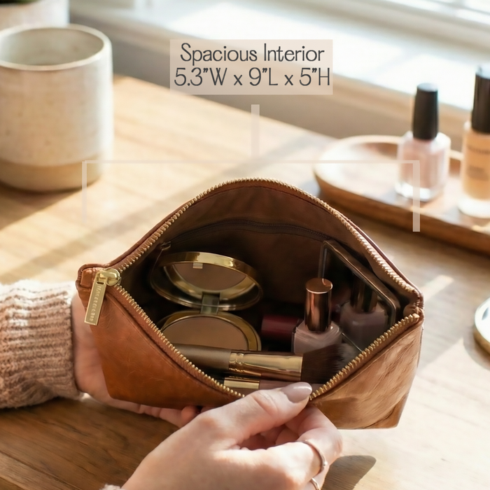 Custom engraved leather cosmetic bag with smooth premium leather texture and zipper closure, offering spacious storage for makeup, skincare products, and travel essentials while showcasing personalized initials that make the pouch a unique gift for women.